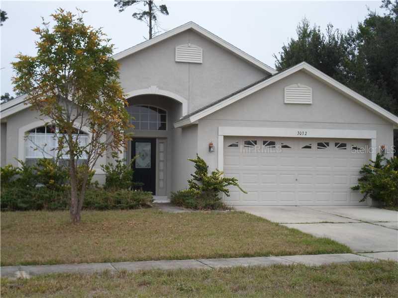 3032 Viewpoint Street Deltona, FL 32725 - Photo 1 of 1 a front view of a house with garden