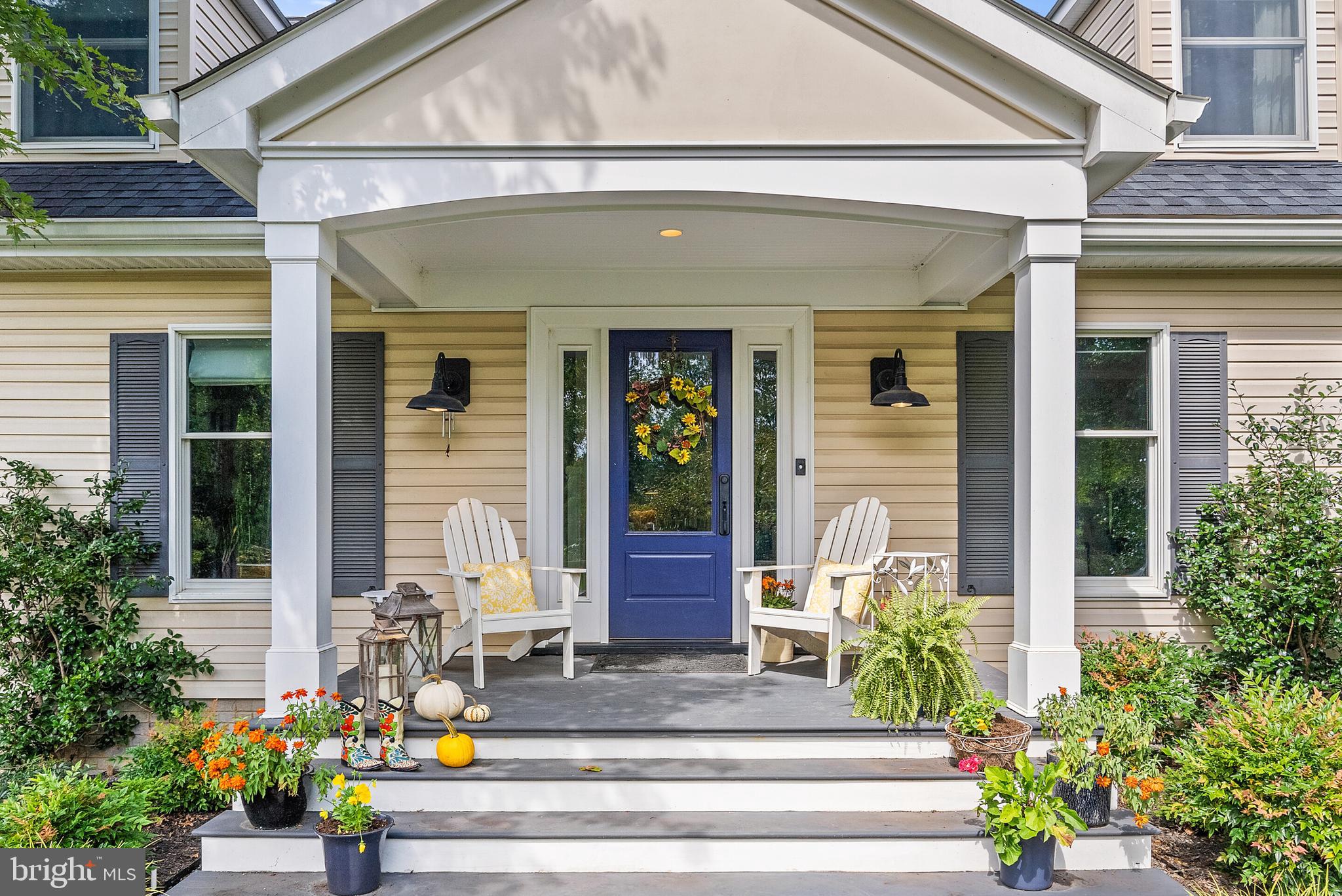 22235 Newlin Mill Road Middleburg, VA 20117 - Photo 2 of 106 a front view of brick house with a potted plant and potted plants