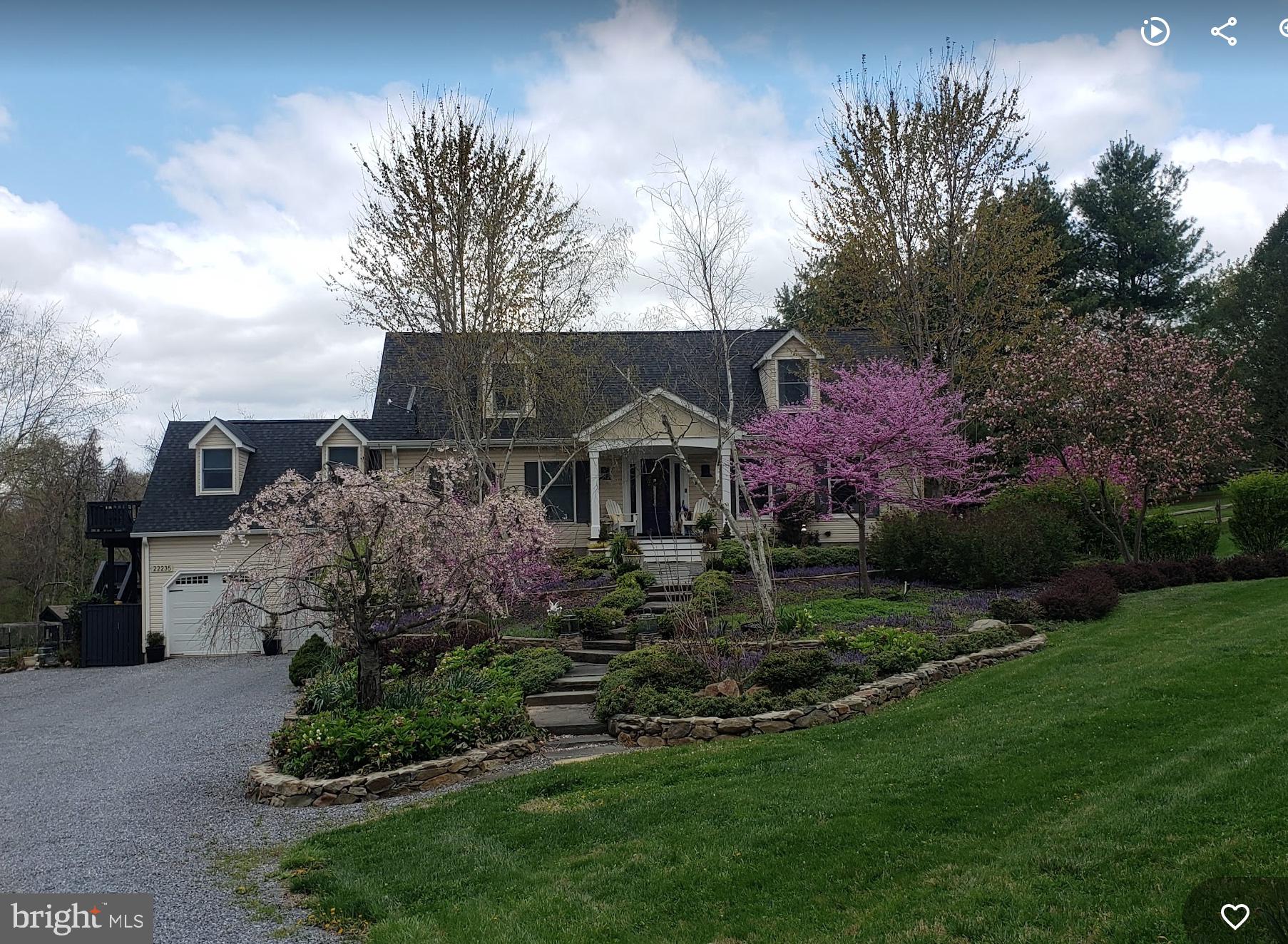 22235 Newlin Mill Road Middleburg, VA 20117 - Photo 11 of 106 a front view of a house with a garden