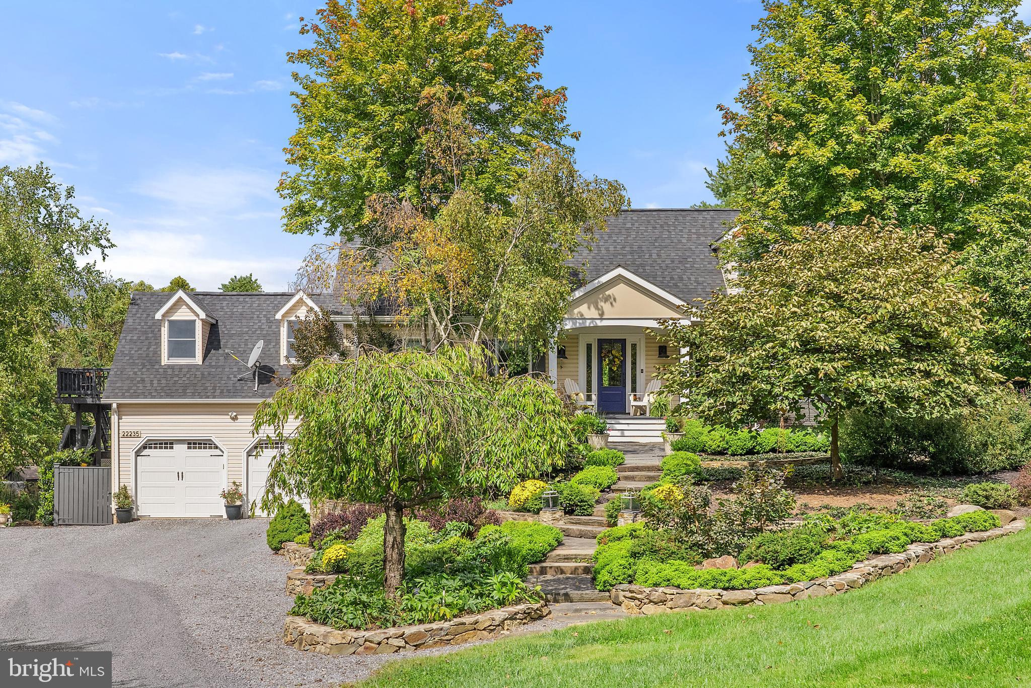 22235 Newlin Mill Road Middleburg, VA 20117 - Photo 14 of 106 a front view of a house with a yard and tree