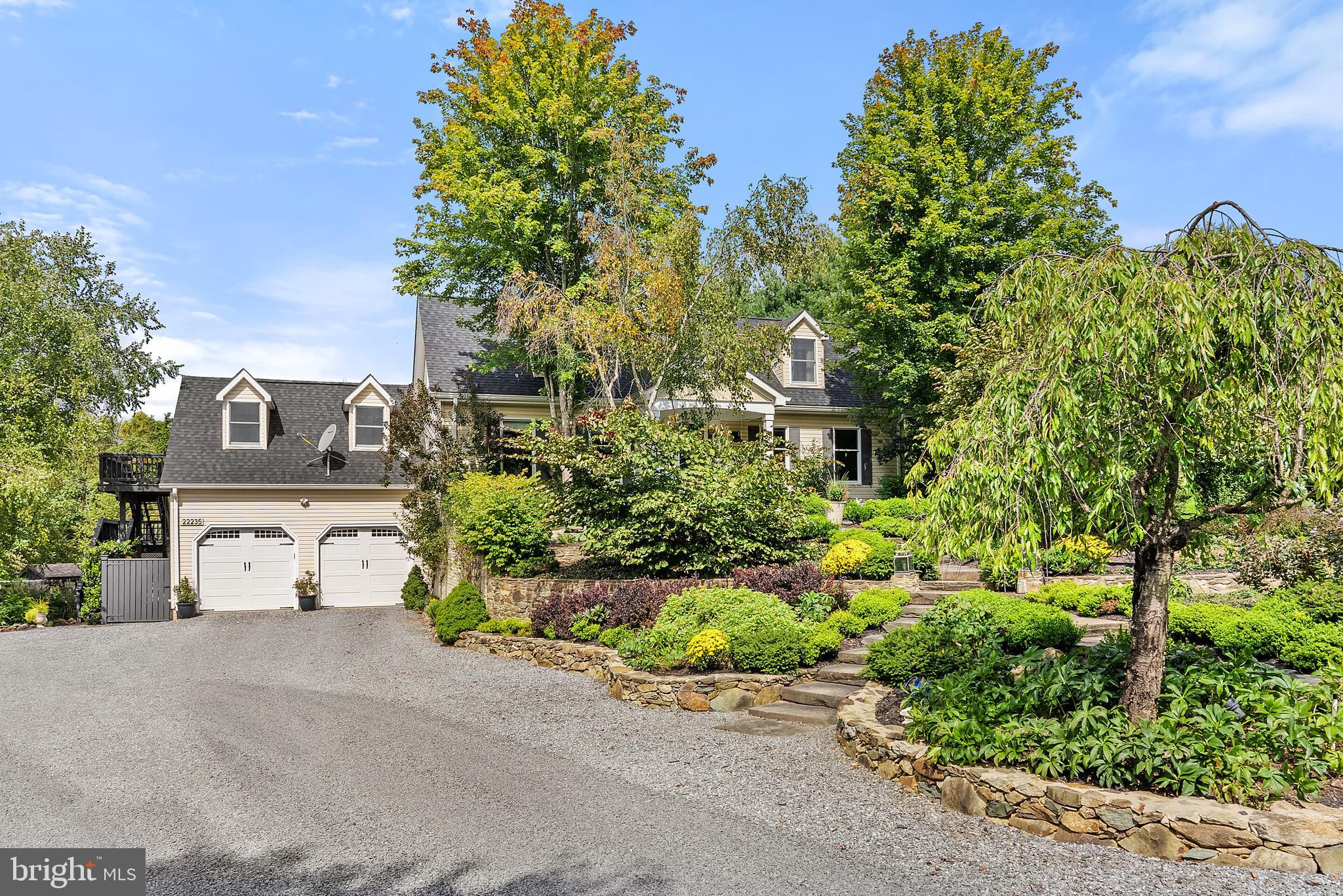 22235 Newlin Mill Road Middleburg, VA 20117 - Photo 24 of 106 a view of a street with potted plants and large trees