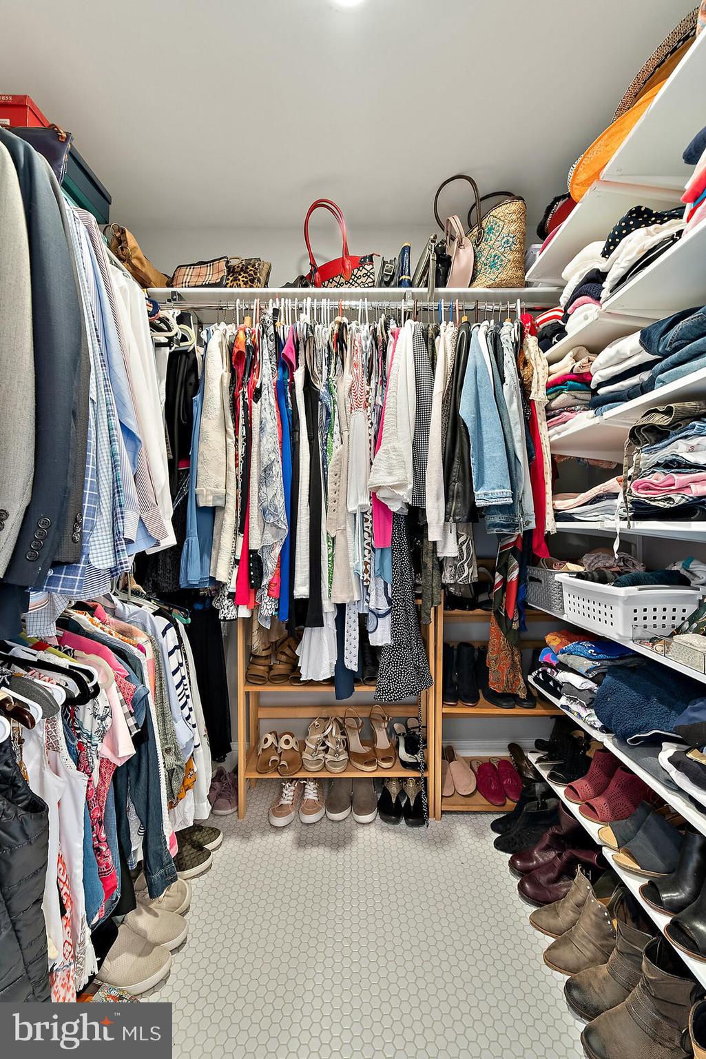 22235 Newlin Mill Road Middleburg, VA 20117 - Photo 62 of 106 a view of walk in closet with clothes and shoes