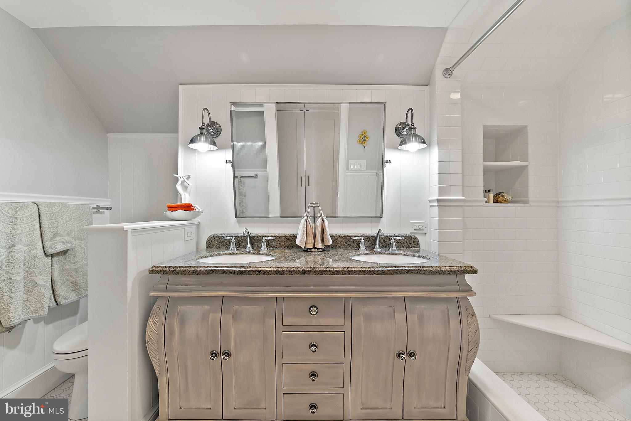 22235 Newlin Mill Road Middleburg, VA 20117 - Photo 67 of 106 a bathroom with a granite countertop sink and a mirror