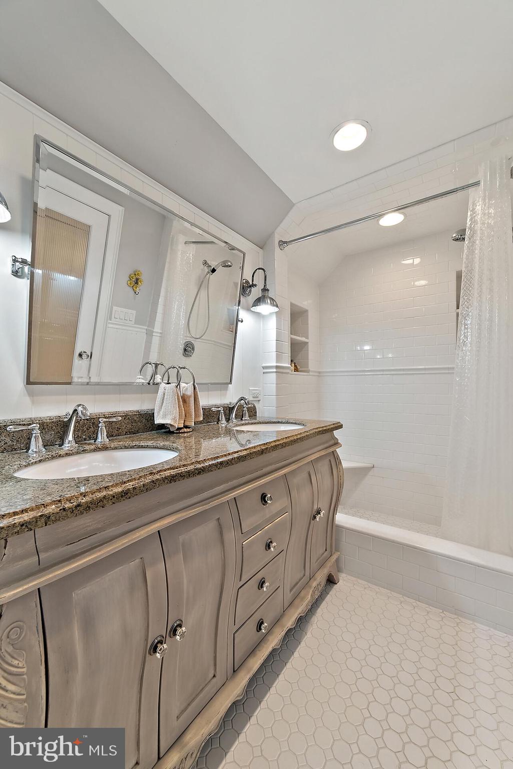 22235 Newlin Mill Road Middleburg, VA 20117 - Photo 68 of 106 a bathroom with double sink and a mirror