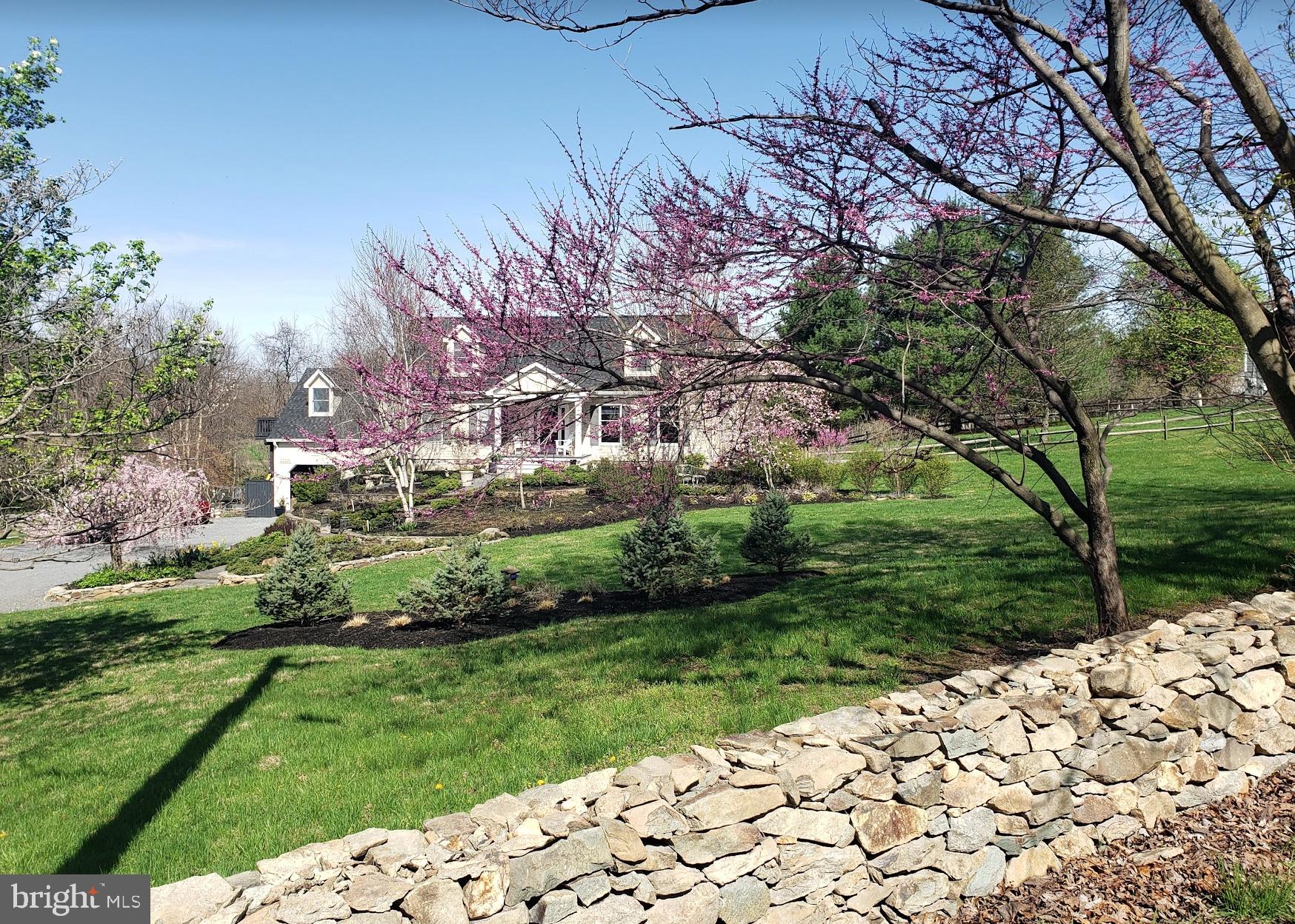 22235 Newlin Mill Road Middleburg, VA 20117 - Photo 10 of 106 a view of a garden with a pathway