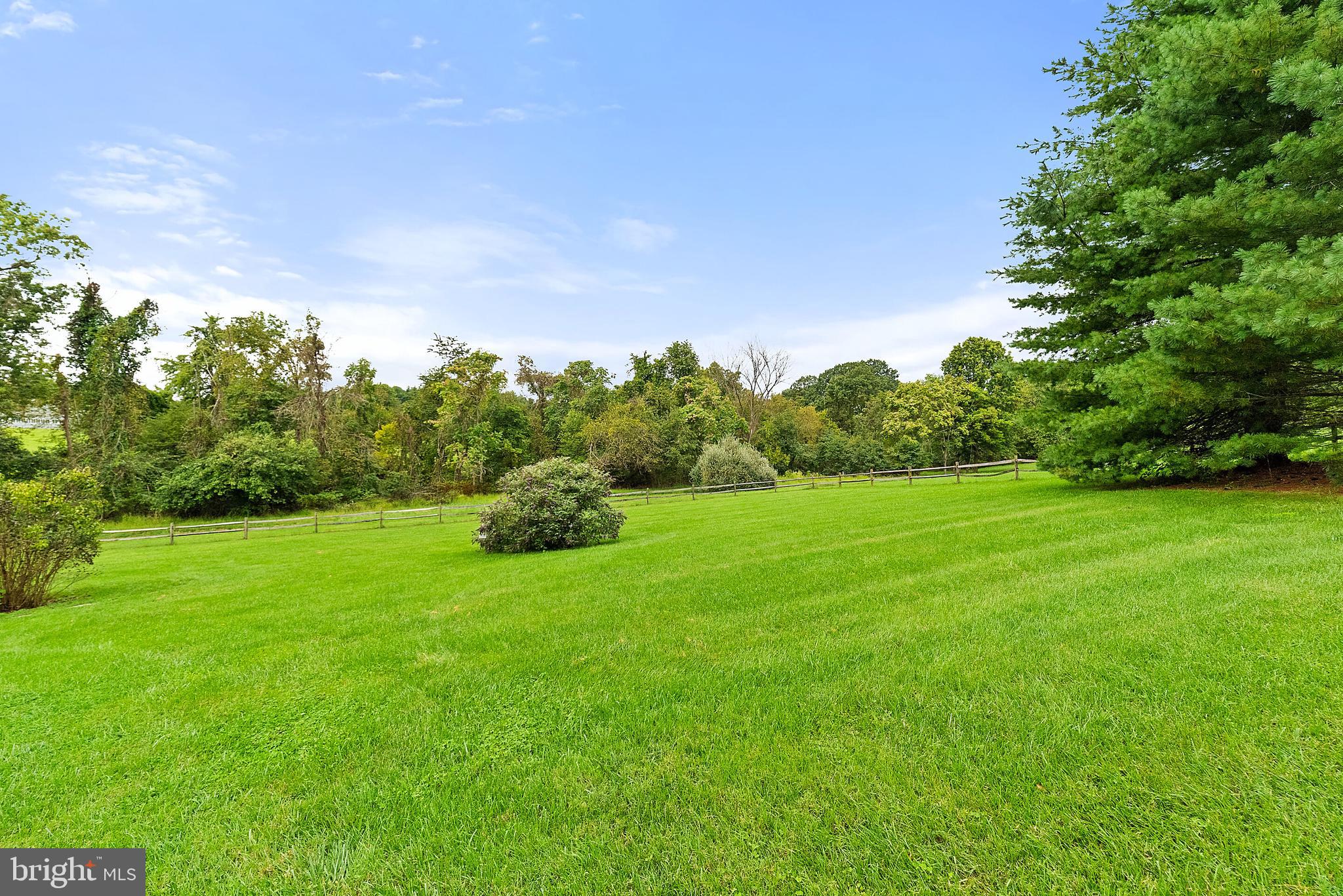 22235 Newlin Mill Road Middleburg, VA 20117 - Photo 89 of 106 a backyard of a house with lots of green space and garden view