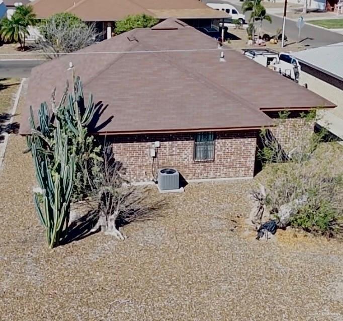 7329 Monroe Street Mission, TX 78572 - Photo 3 of 3 an aerial view of a house with a yard and potted plants