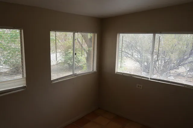 a view of an empty room with stairs