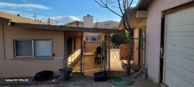 a spacious bathroom with double vanity and a mirror