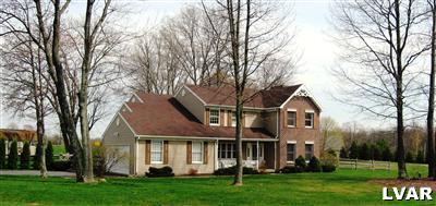 1338 Broad Road Wind Gap, PA 18091 - Photo 1 of 22 a front view of a house with a garden