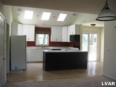 1338 Broad Road Wind Gap, PA 18091 - Photo 3 of 22 a view of kitchen with stainless steel appliances granite countertop a refrigerator and a stove