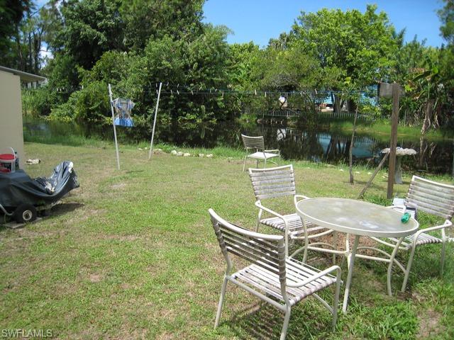 21 Ocho Rios Naples, FL 34114 - Photo 1 of 14 a patio with table and chairs