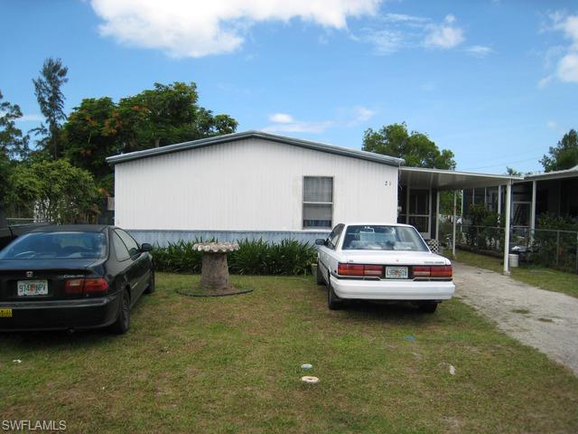 21 Ocho Rios Naples, FL 34114 - Photo 14 of 14 a car parked in front of a house