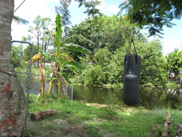 21 Ocho Rios Naples, FL 34114 - Photo 2 of 14 a view of a garden with a fountain
