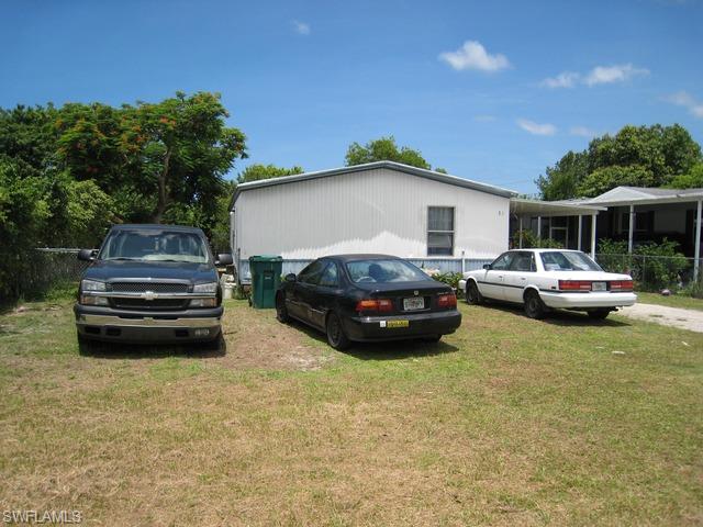 21 Ocho Rios Naples, FL 34114 - Photo 3 of 14 a car parked in front of a house