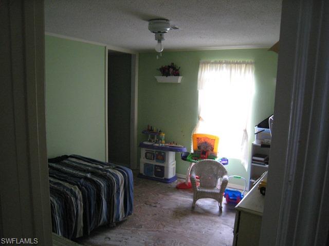 21 Ocho Rios Naples, FL 34114 - Photo 6 of 14 a bedroom with a bed and window