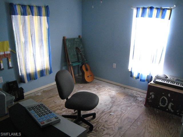 21 Ocho Rios Naples, FL 34114 - Photo 7 of 14 a living room with furniture and a window