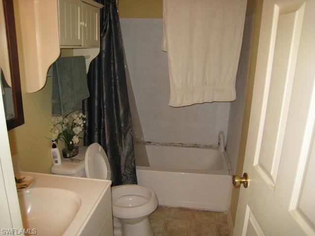 21 Ocho Rios Naples, FL 34114 - Photo 8 of 14 a bathroom with a sink toilet and shower