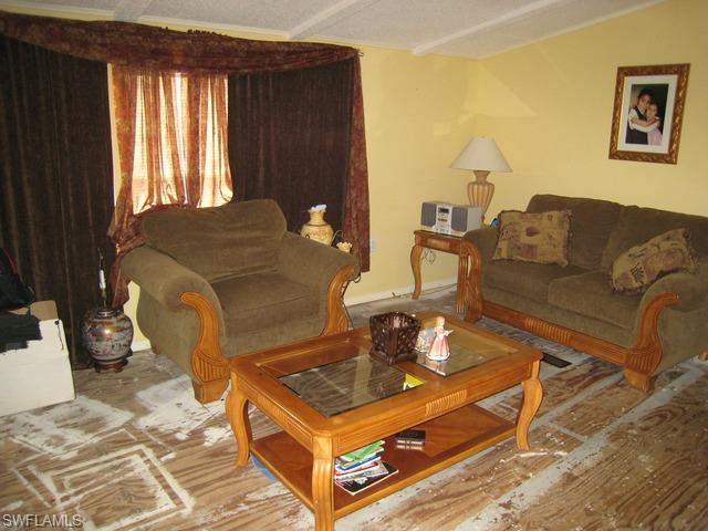 21 Ocho Rios Naples, FL 34114 - Photo 9 of 14 a living room with furniture