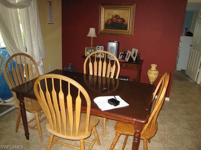 21 Ocho Rios Naples, FL 34114 - Photo 10 of 14 a view of a dining room with furniture and window