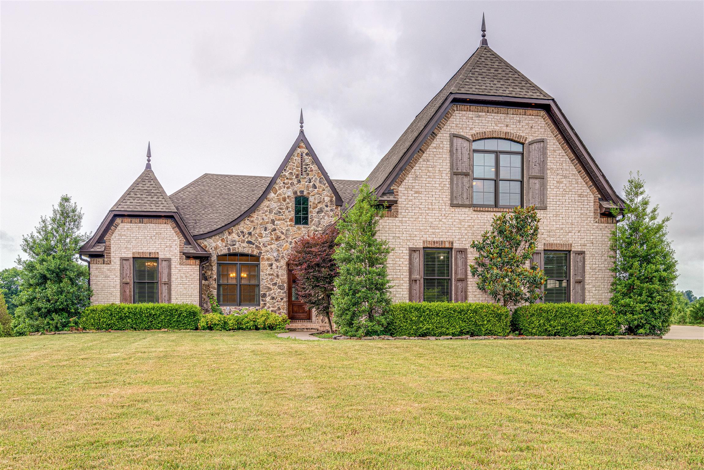 2610 Gunn Road Adams, TN 37010 - Photo 1 of 24 a front view of a house with a yard