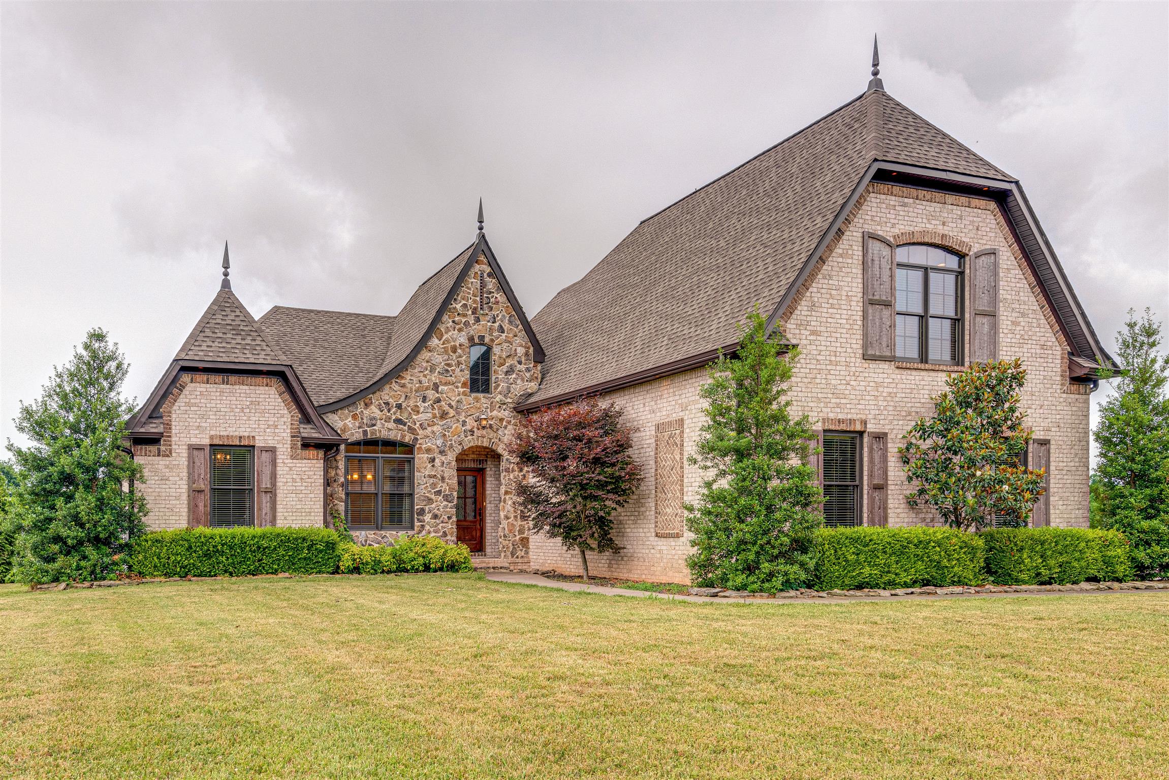 2610 Gunn Road Adams, TN 37010 - Photo 2 of 24 a front view of a house with a yard and garage