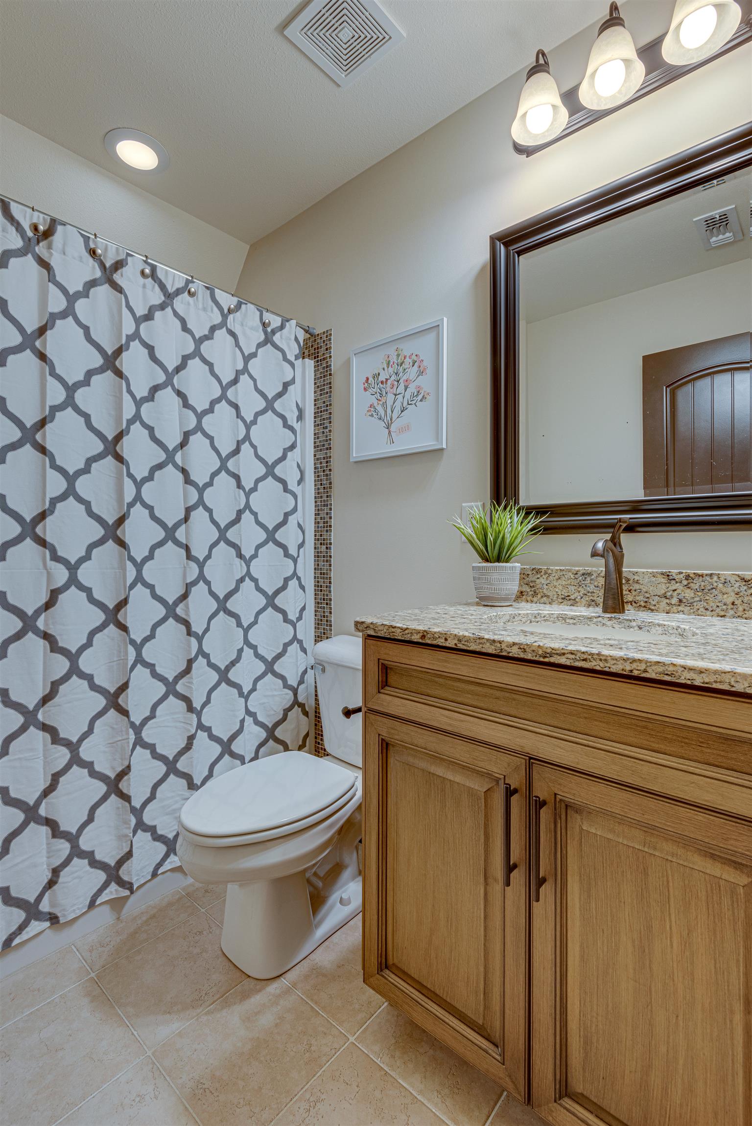 2610 Gunn Road Adams, TN 37010 - Photo 20 of 24 a bathroom with a granite countertop toilet and a sink