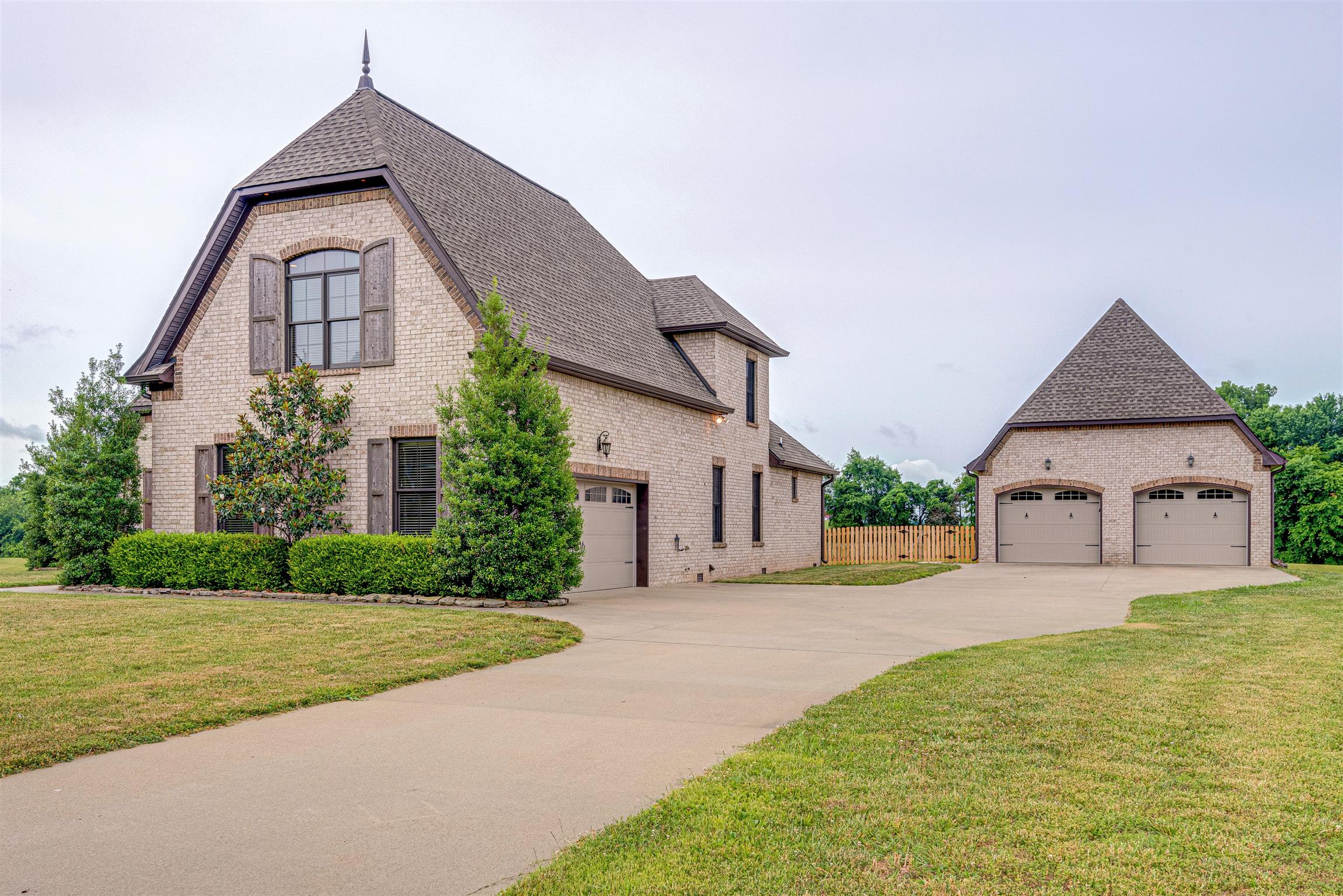 2610 Gunn Road Adams, TN 37010 - Photo 23 of 24 a front view of a house with a yard and garage