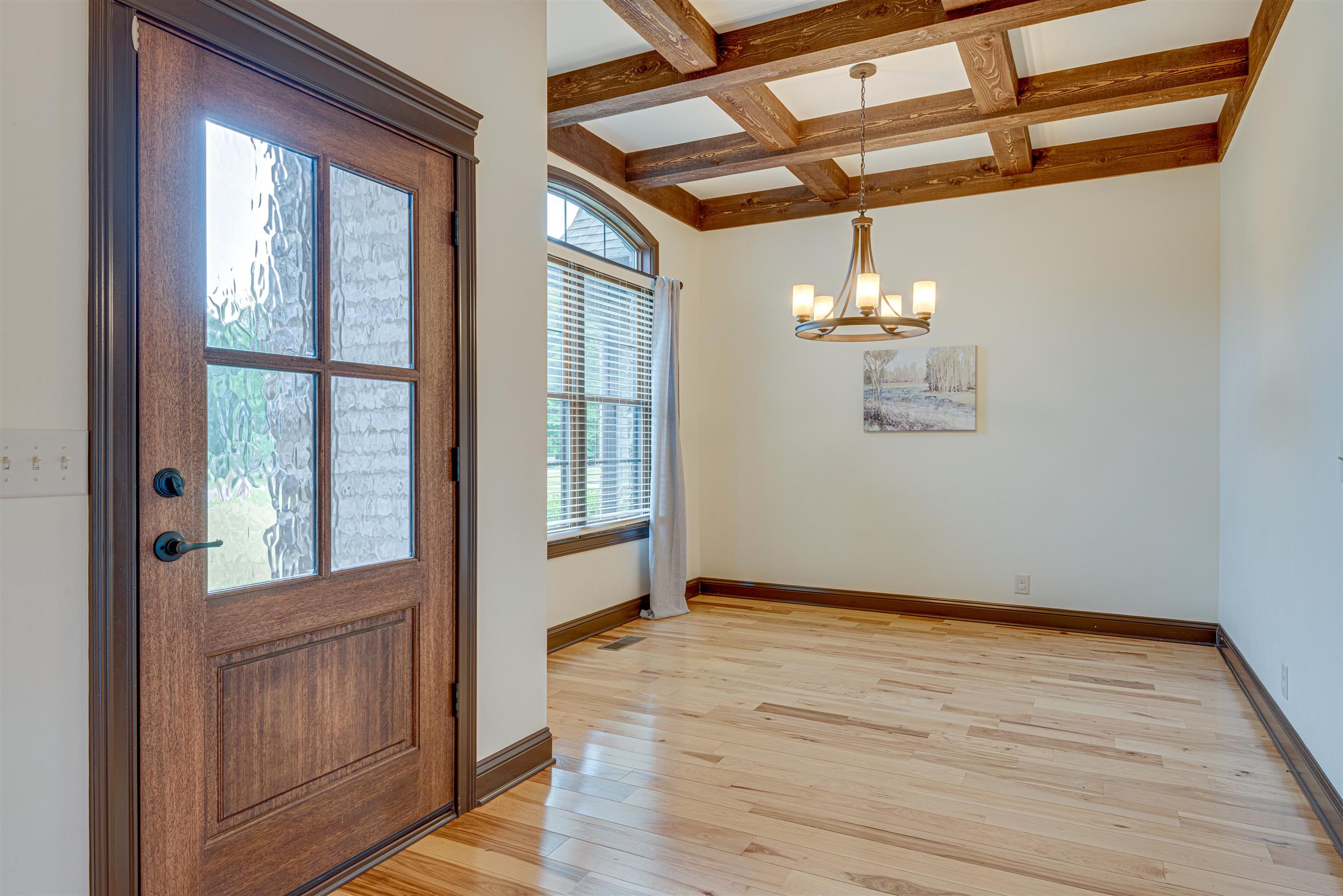 2610 Gunn Road Adams, TN 37010 - Photo 4 of 24 a view of an empty room with wooden floor and a window