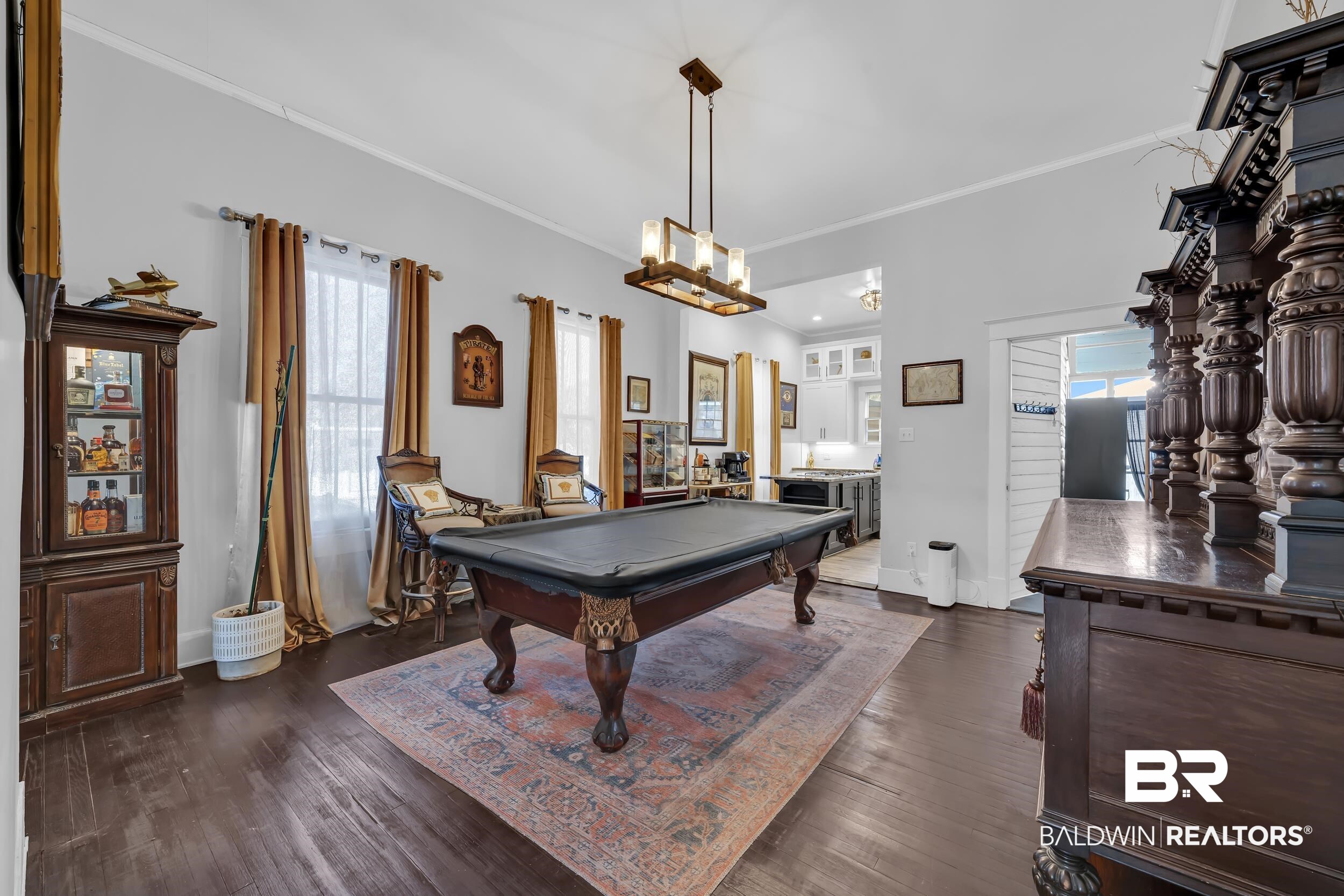 1322 Dauphin Street Mobile, AL 36604 - Photo 9 of 21 Game room with crown molding, billiards, plenty of natural light, and dark wood-type flooring
