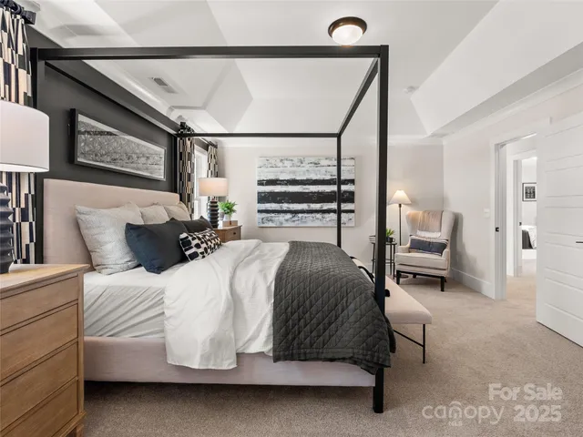 a bedroom with a bed and a chair