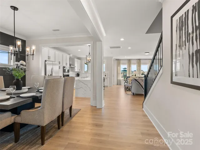 a dining room with furniture and entryway