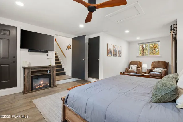 a bedroom with furniture and a window