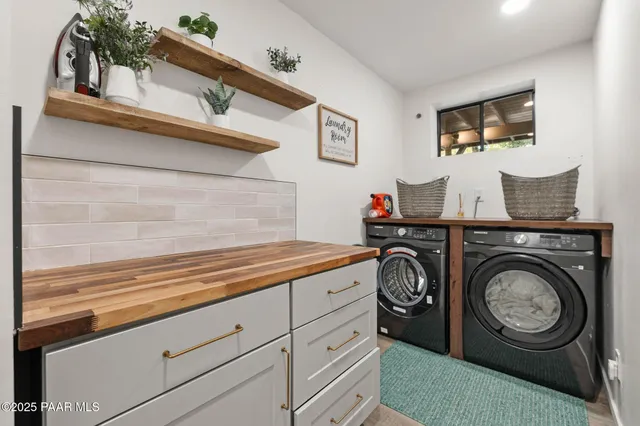 a bathroom with a sink vanity and toilet