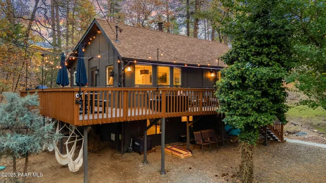 a view of balcony with wooden floor and outdoor seating