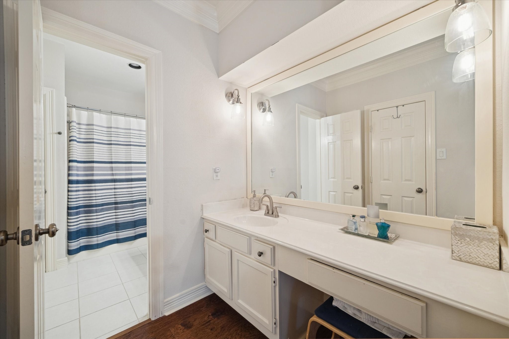 4001 Tanglewilde Street, Unit 1103 Houston, TX 77063 - Photo 14 of 15 a bathroom with a double vanity sink and mirror