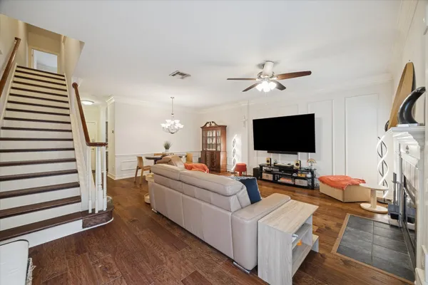 a living room with furniture flat screen tv and a fireplace