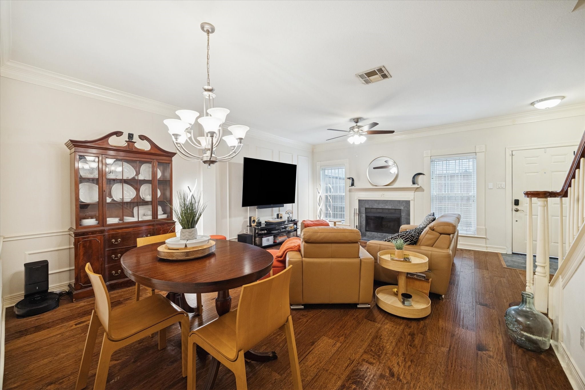 4001 Tanglewilde Street, Unit 1103 Houston, TX 77063 - Photo 6 of 15 a view of a dining room with furniture a chandelier and wooden floor