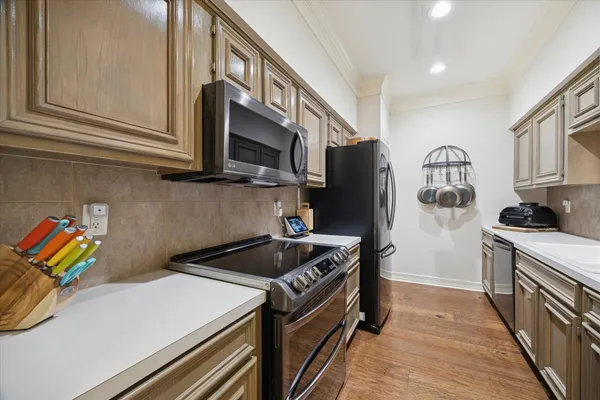 a kitchen with a sink and a stove top oven
