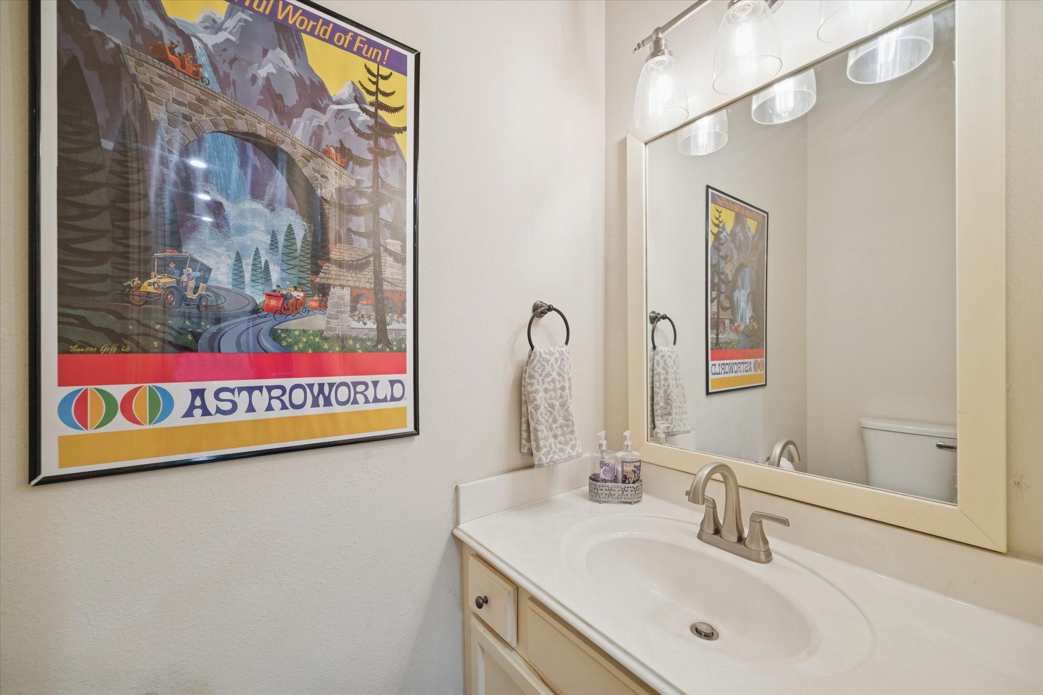 4001 Tanglewilde Street, Unit 1103 Houston, TX 77063 - Photo 9 of 15 a bathroom with a sink and a mirror