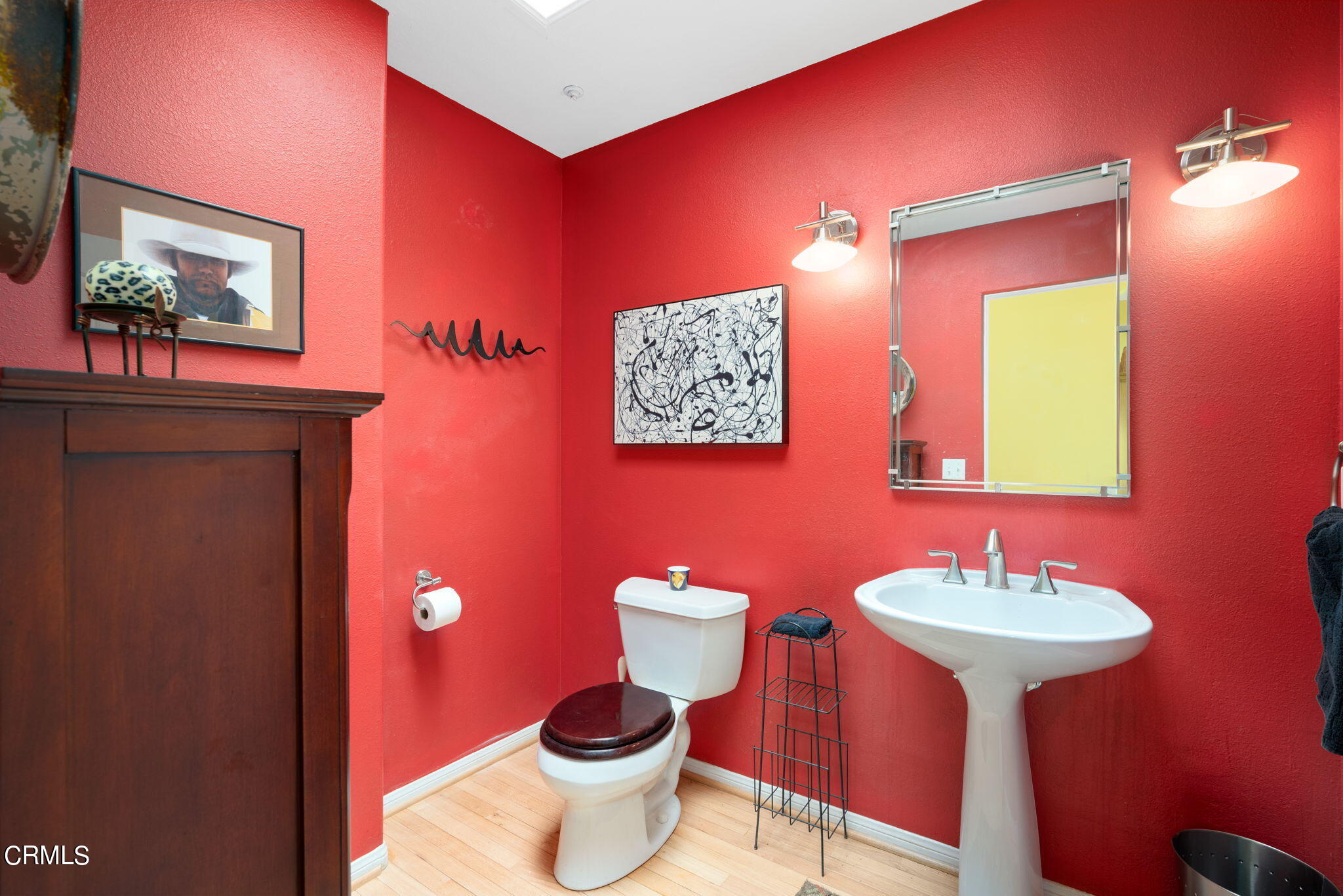 2249 Rim Road Palm Springs, CA 92264 - Photo 14 of 41 a bathroom with a toilet a sink and mirror