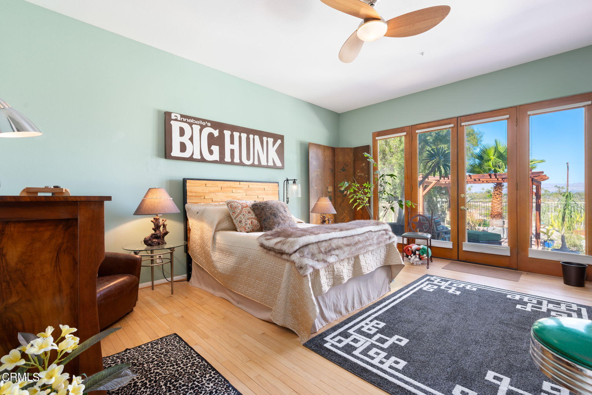 2249 Rim Road Palm Springs, CA 92264 - Photo 19 of 41 a bedroom with a bed and wooden floor