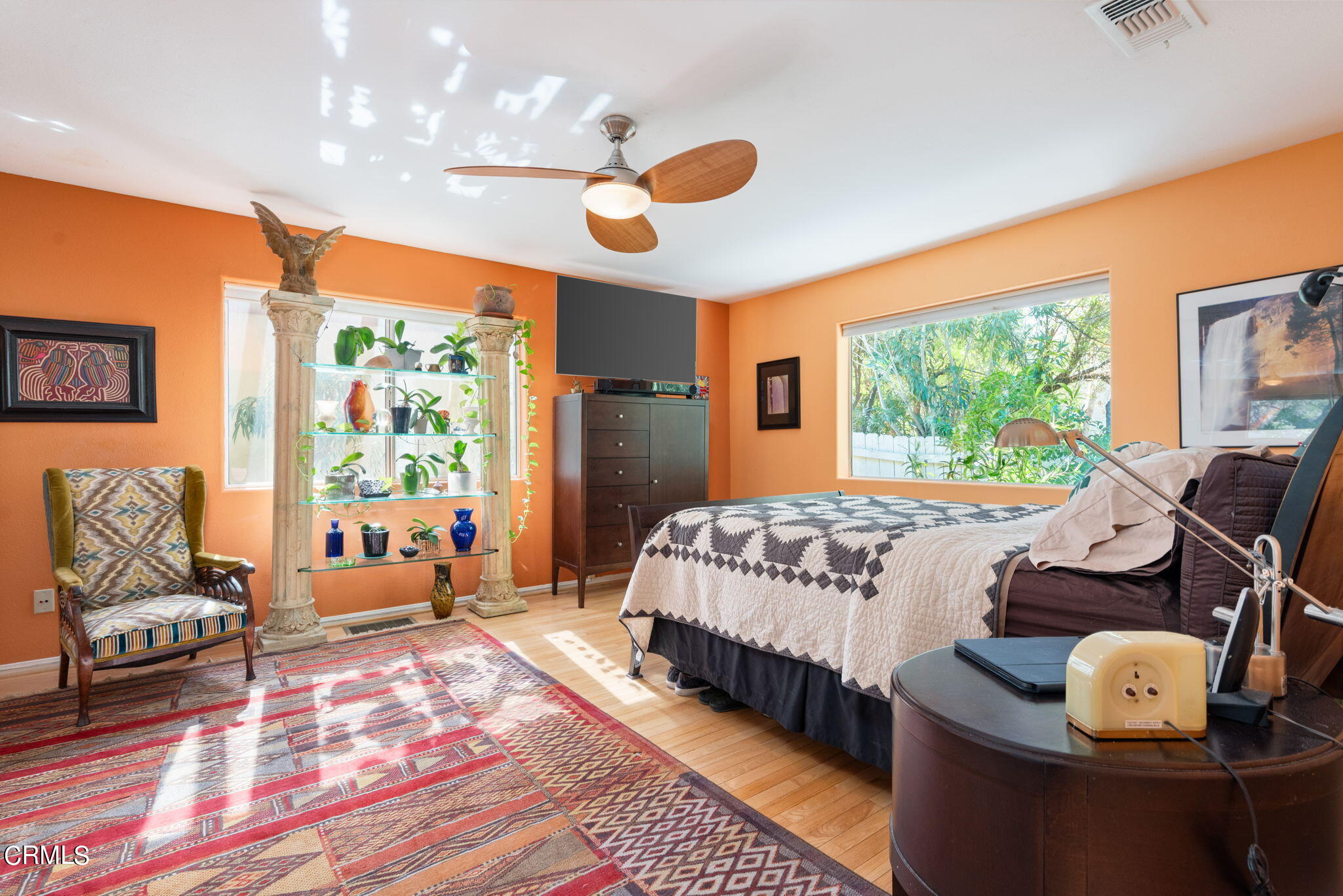 2249 Rim Road Palm Springs, CA 92264 - Photo 23 of 41 a bedroom with a bed and wooden floor