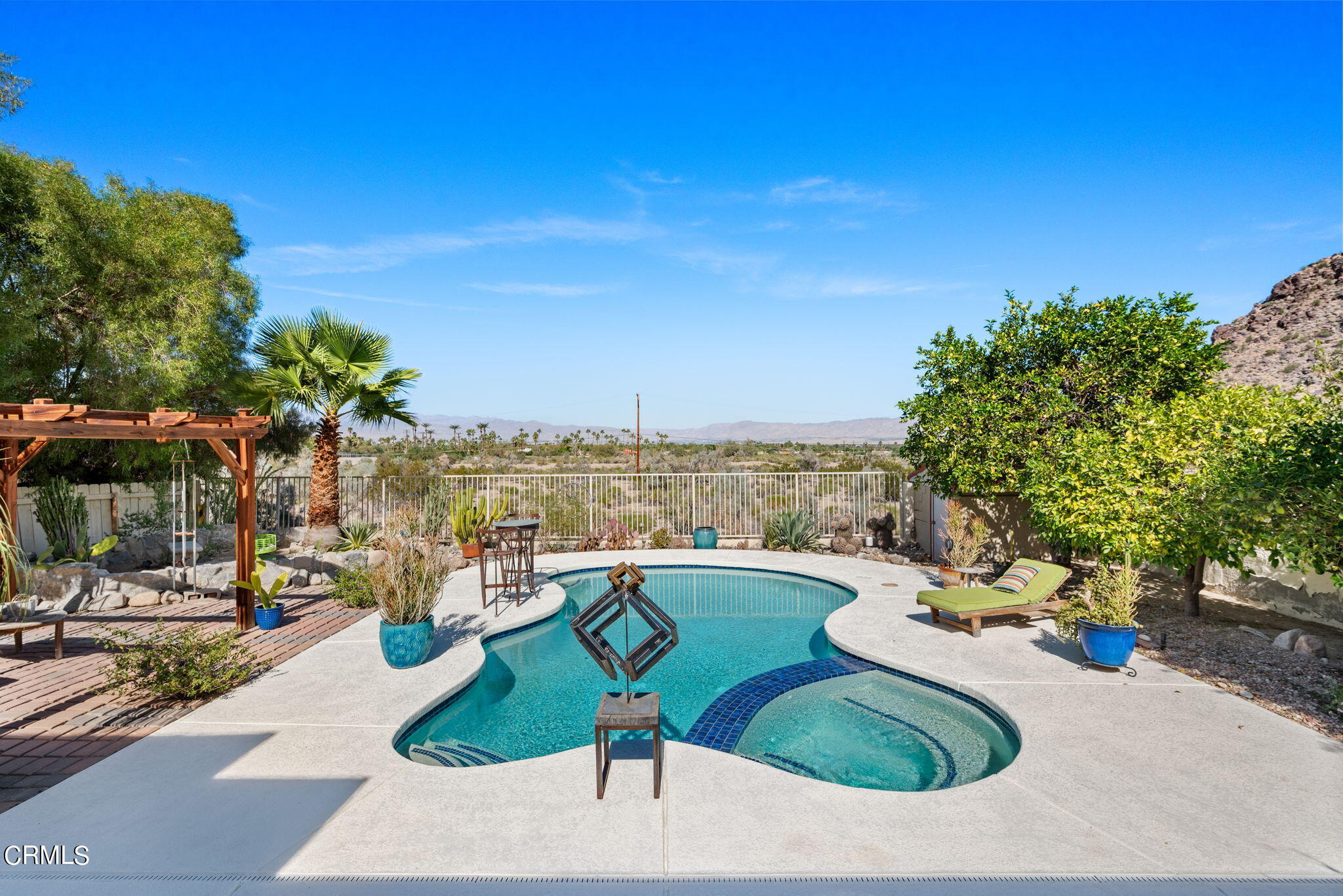 2249 Rim Road Palm Springs, CA 92264 - Photo 29 of 41 a view of a swimming pool with a patio
