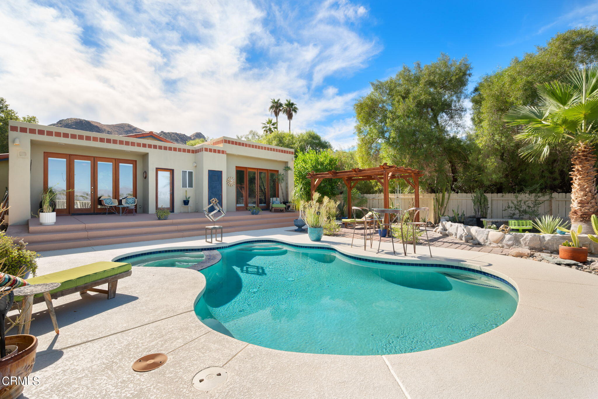 2249 Rim Road Palm Springs, CA 92264 - Photo 32 of 41 a view of a house with swimming pool and sitting area