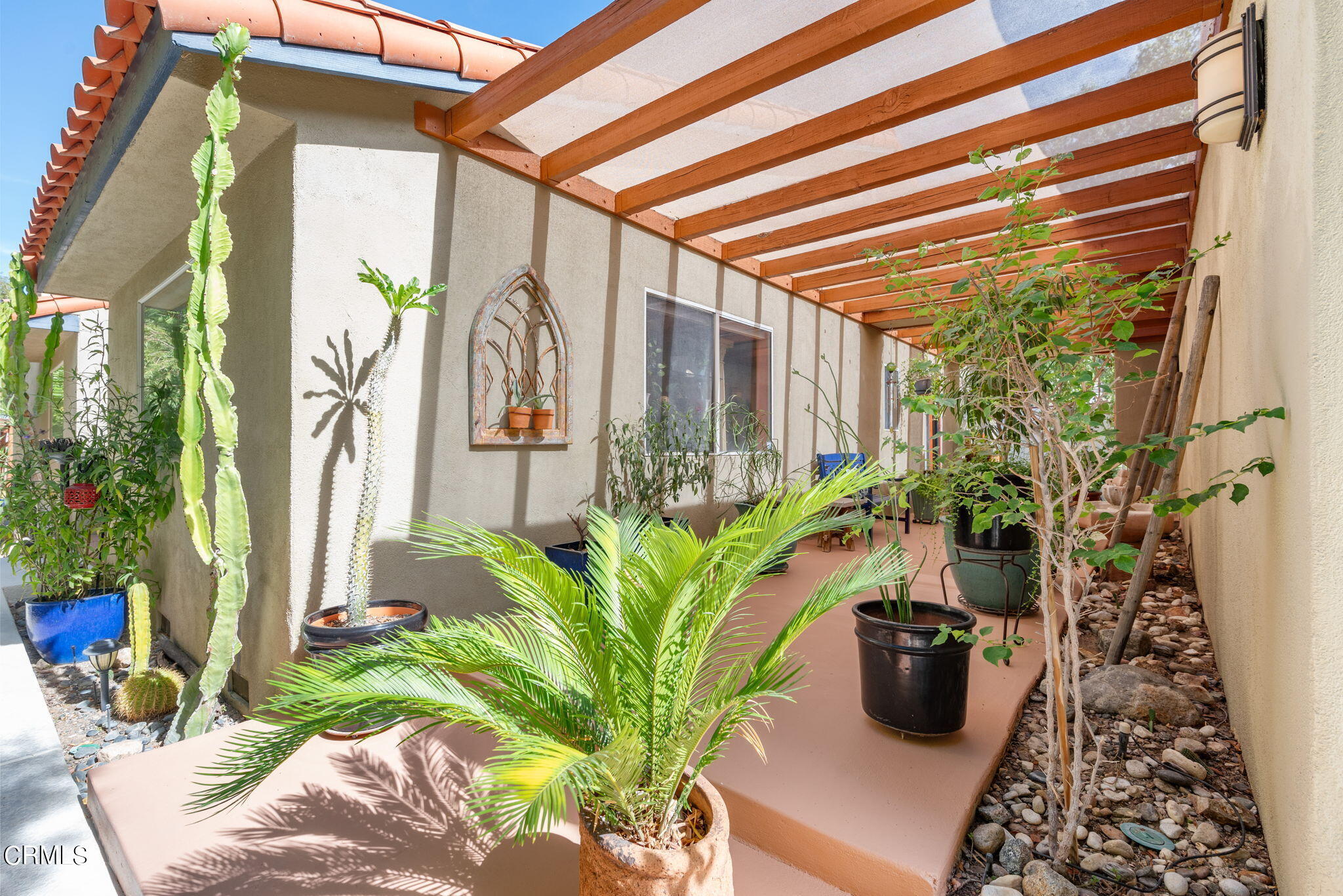 2249 Rim Road Palm Springs, CA 92264 - Photo 7 of 41 a potted plant sitting in front of a house