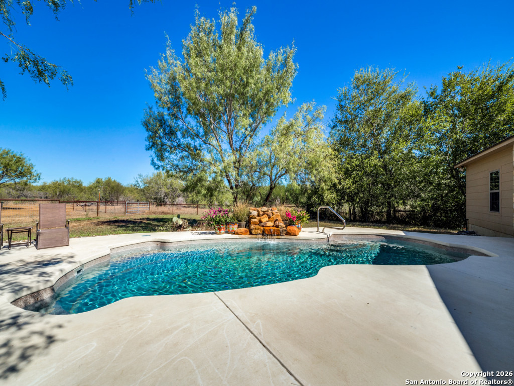 6472 Bluntzer Road Jourdanton, TX 78026 - Photo 17 of 45 a view of a park with plants and trees