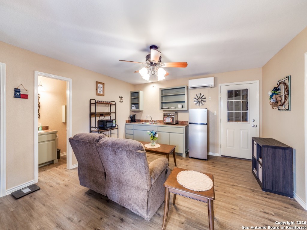 6472 Bluntzer Road Jourdanton, TX 78026 - Photo 24 of 45 a living room with furniture and a table