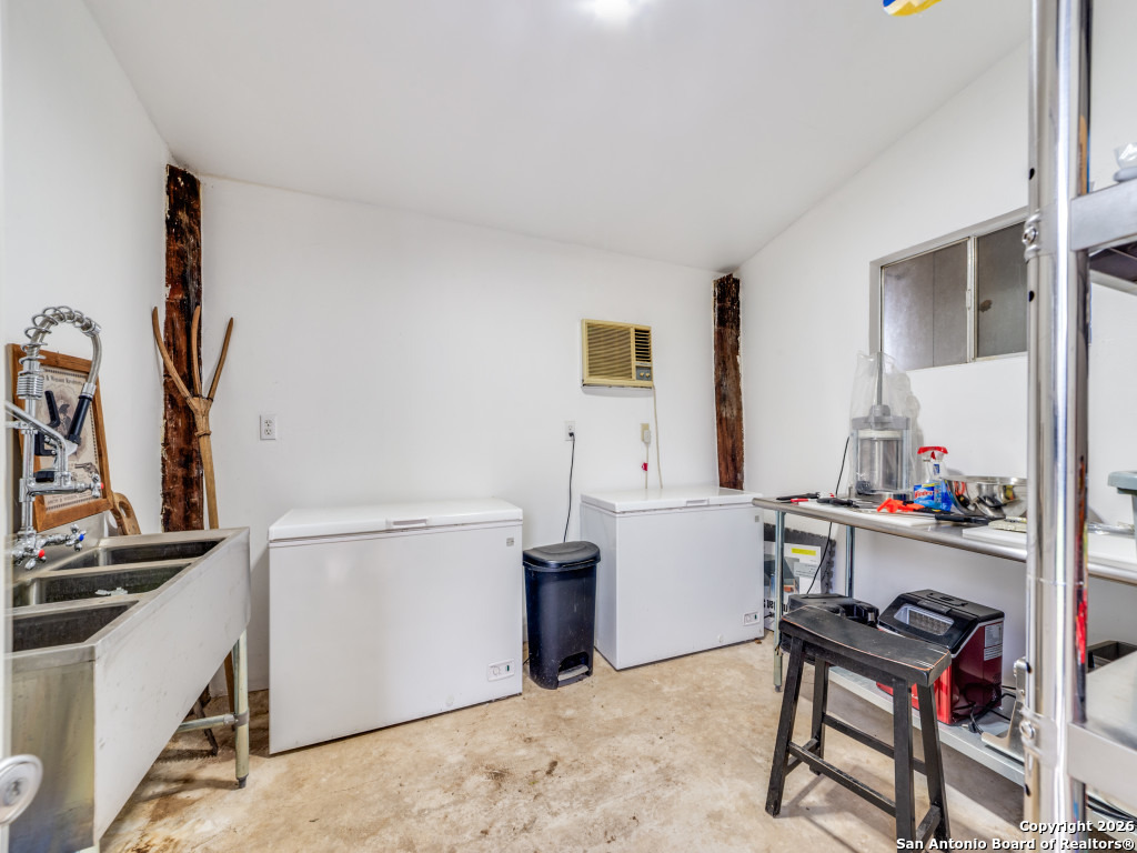 6472 Bluntzer Road Jourdanton, TX 78026 - Photo 26 of 45 a view of a workspace with furniture