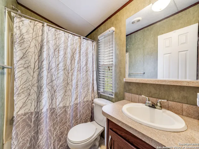 a bathroom with a sink a toilet and tub